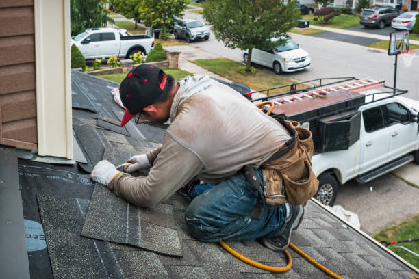 Professional Roofing technician working in Warren, OR